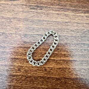 Solid gold flexible chain ring.